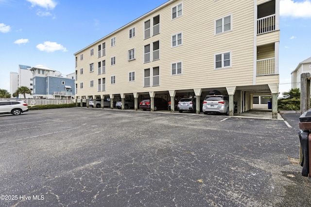 1004 Carolina Beach Ave S Unit A4, Carolina Beach, NC 28428 - view of building exterior featuring uncovered parking