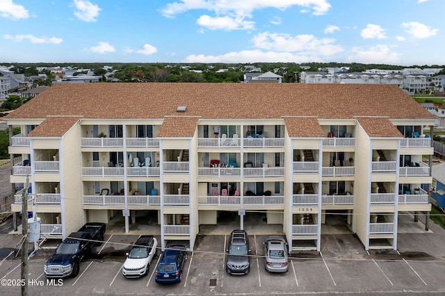 1004 Carolina Beach Ave S Unit A4, Carolina Beach, NC 28428 - view of apartment building / complex featuring uncovered parking