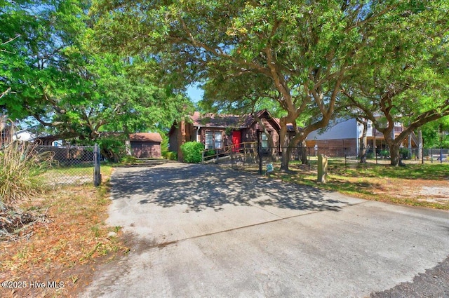 163 NW 9th St, Oak Island, NC 28465 - obstructed view of property with a fenced front yard