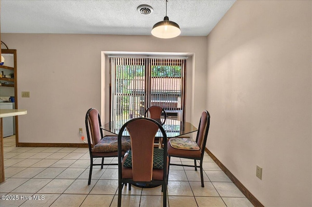 163 NW 9th St, Oak Island, NC 28465 - dining space featuring a textured ceiling and light tile patterned floors