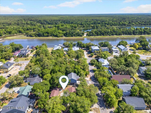 163 NW 9th St, Oak Island, NC 28465 - aerial view of residential area with a forest and a large body of water