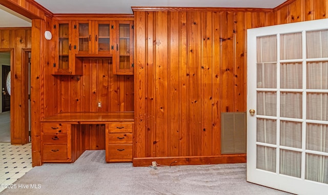 106 E New Hope Rd, Goldsboro, NC 27534 - unfurnished bedroom featuring wooden walls, carpet, and an office area