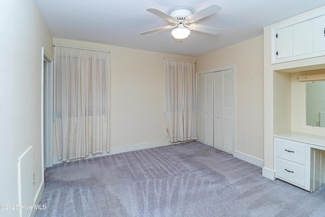 106 E New Hope Rd, Goldsboro, NC 27534 - unfurnished bedroom featuring light colored carpet, a ceiling fan, and a closet