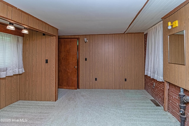 106 E New Hope Rd, Goldsboro, NC 27534 - empty room featuring carpet and wood walls