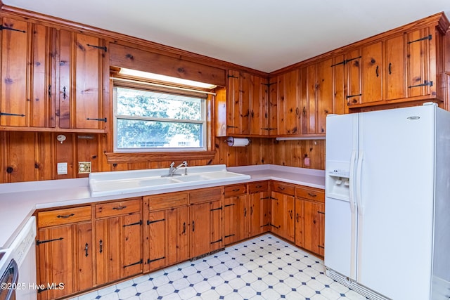106 E New Hope Rd, Goldsboro, NC 27534 - kitchen featuring white appliances, brown cabinetry, light floors, light countertops, and wooden walls