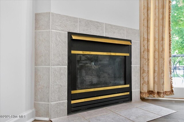 1610 Winding Way SW, Ocean Isle Beach, NC 28469 - detailed view of a tile fireplace and wood finished floors