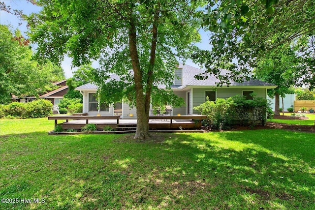 1610 Winding Way SW, Ocean Isle Beach, NC 28469 - back of property featuring a lawn and a wooden deck