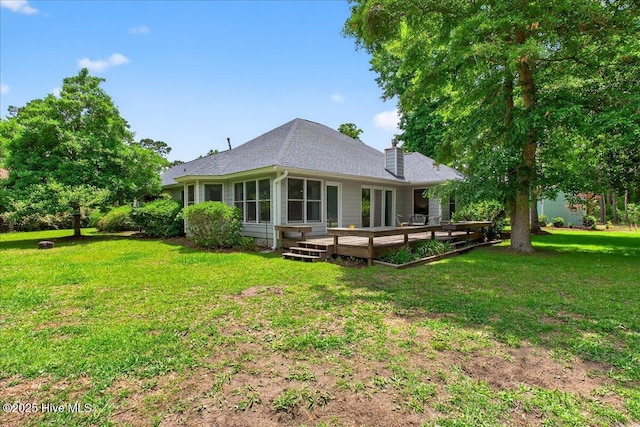 1610 Winding Way SW, Ocean Isle Beach, NC 28469 - back of property featuring a chimney, a yard, and a wooden deck