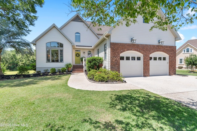 188 Edgewater Cir, Sunset Beach, NC 28468 - traditional-style house featuring driveway, brick siding, a front yard, and a garage
