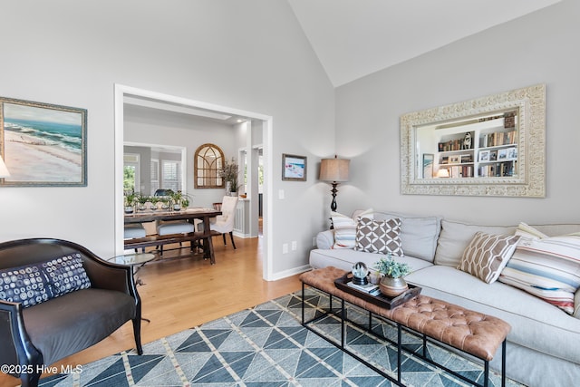 188 Edgewater Cir, Sunset Beach, NC 28468 - living room with vaulted ceiling and wood finished floors