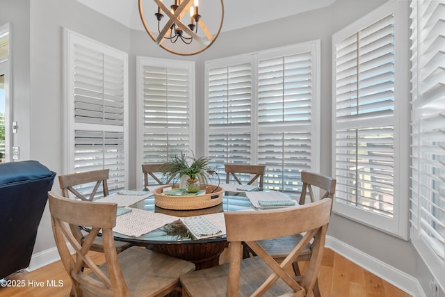 188 Edgewater Cir, Sunset Beach, NC 28468 - dining area featuring light wood finished floors and a chandelier