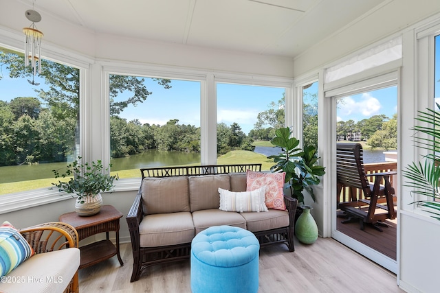 188 Edgewater Cir, Sunset Beach, NC 28468 - sunroom featuring a water view, view of wooded area, and outdoor lounge area