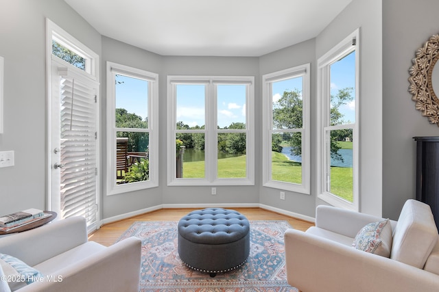 188 Edgewater Cir, Sunset Beach, NC 28468 - living area with a water view and light wood-style flooring
