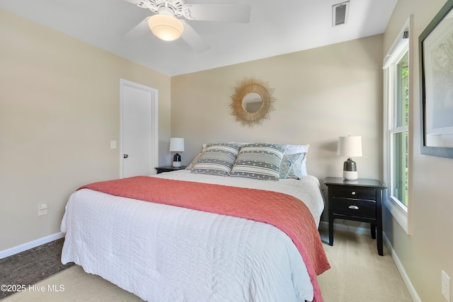 188 Edgewater Cir, Sunset Beach, NC 28468 - bedroom featuring carpet flooring, multiple windows, and ceiling fan