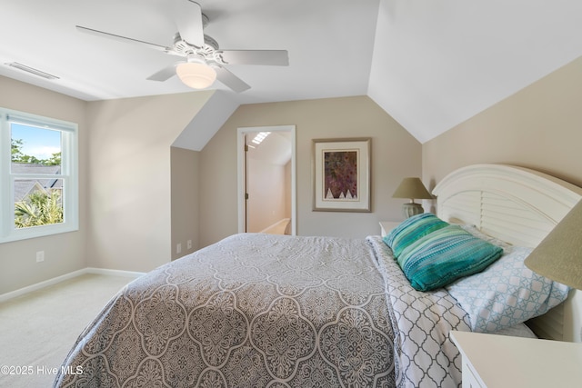 188 Edgewater Cir, Sunset Beach, NC 28468 - bedroom with light carpet, lofted ceiling, and a ceiling fan