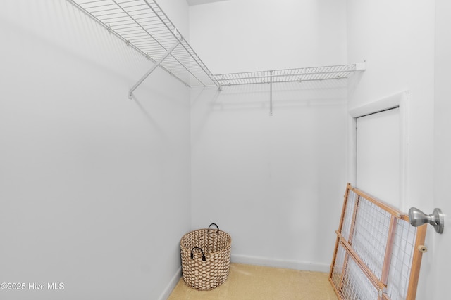 188 Edgewater Cir, Sunset Beach, NC 28468 - walk in closet featuring carpet floors