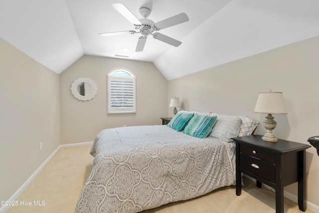 188 Edgewater Cir, Sunset Beach, NC 28468 - bedroom featuring light colored carpet, lofted ceiling, and a ceiling fan