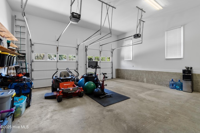 188 Edgewater Cir, Sunset Beach, NC 28468 - garage with a garage door opener and wainscoting