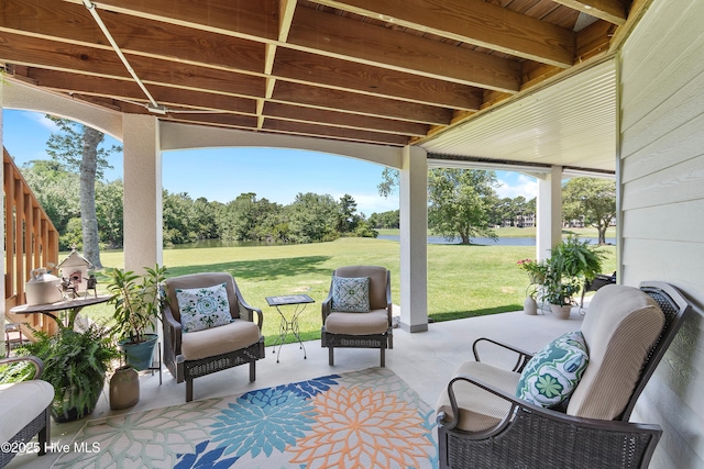 188 Edgewater Cir, Sunset Beach, NC 28468 - view of patio with a water view and view of scattered trees