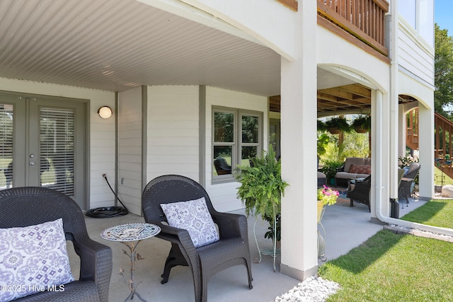 188 Edgewater Cir, Sunset Beach, NC 28468 - view of patio / terrace featuring an outdoor hangout area and french doors