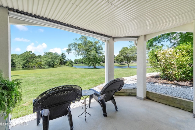 188 Edgewater Cir, Sunset Beach, NC 28468 - view of patio with a water view