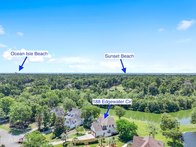 188 Edgewater Cir, Sunset Beach, NC 28468 - bird's eye view of a large body of water and a heavily wooded area