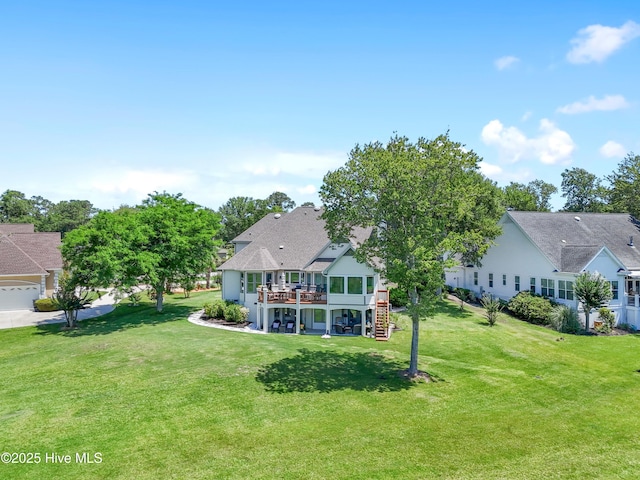 188 Edgewater Cir, Sunset Beach, NC 28468 - back of house featuring a yard, a wooden deck, and stairs