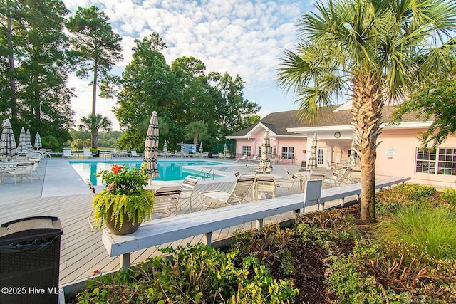 188 Edgewater Cir, Sunset Beach, NC 28468 - community pool with a deck, a patio area, and outdoor dining area