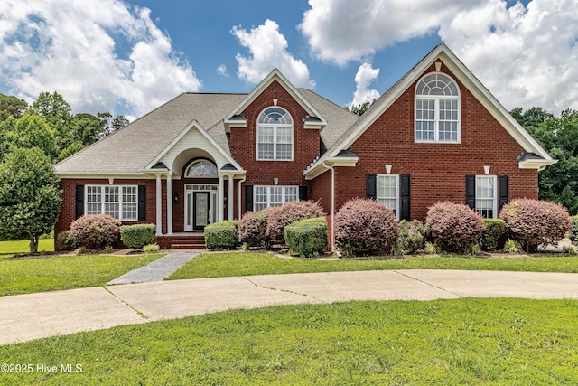 112 Highwoods Dr, Goldsboro, NC 27530 - traditional home with brick siding and a front lawn