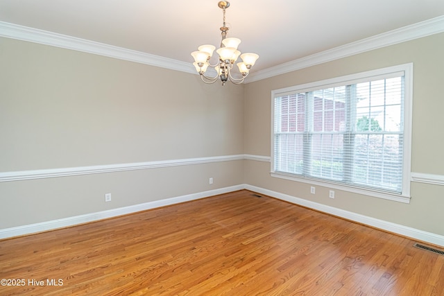 112 Highwoods Dr, Goldsboro, NC 27530 - unfurnished room featuring a chandelier, crown molding, and light wood-style flooring