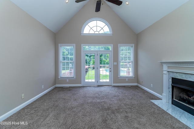 112 Highwoods Dr, Goldsboro, NC 27530 - unfurnished living room featuring carpet, ceiling fan, a high end fireplace, and high vaulted ceiling