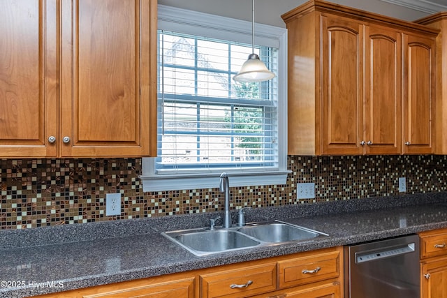 112 Highwoods Dr, Goldsboro, NC 27530 - kitchen featuring stainless steel dishwasher, brown cabinets, dark countertops, and backsplash