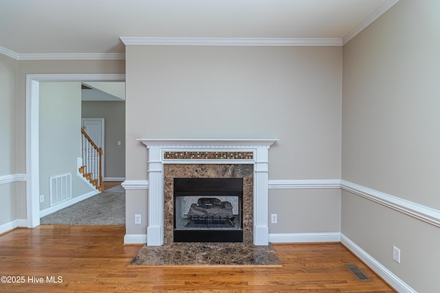 112 Highwoods Dr, Goldsboro, NC 27530 - detailed view of wood finished floors, ornamental molding, and a fireplace