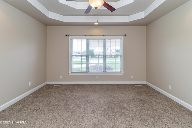 112 Highwoods Dr, Goldsboro, NC 27530 - unfurnished room featuring a raised ceiling, ceiling fan, and carpet flooring
