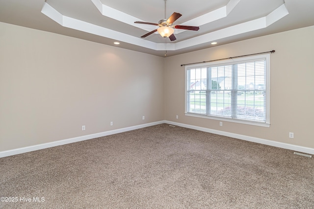 112 Highwoods Dr, Goldsboro, NC 27530 - carpeted empty room featuring a raised ceiling, ceiling fan, and recessed lighting