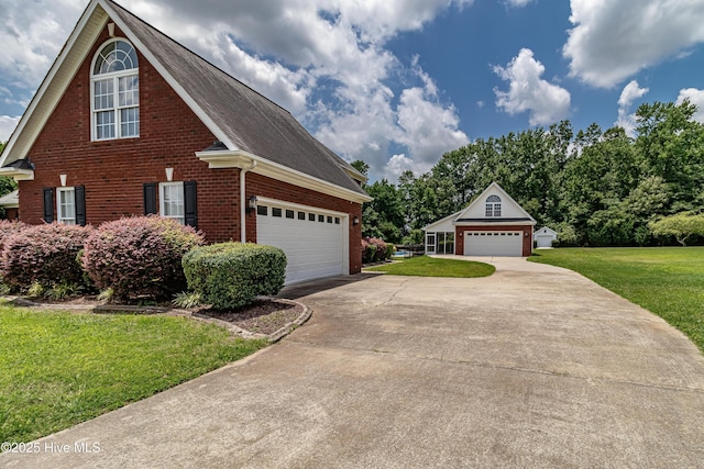 112 Highwoods Dr, Goldsboro, NC 27530 - view of front facade with brick siding, a front lawn, a detached garage, and roof with shingles