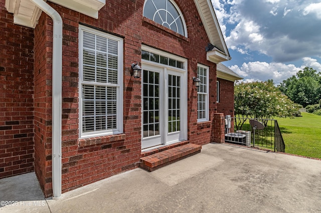 112 Highwoods Dr, Goldsboro, NC 27530 - doorway to property featuring brick siding and a yard