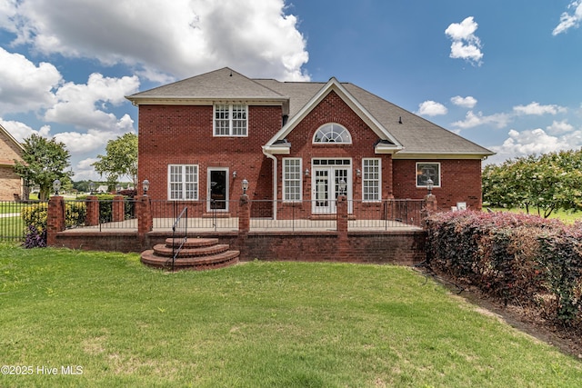 112 Highwoods Dr, Goldsboro, NC 27530 - back of house with brick siding, a patio, french doors, and a shingled roof