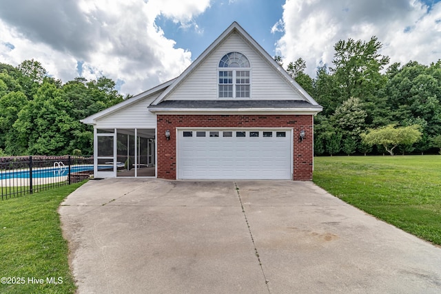 112 Highwoods Dr, Goldsboro, NC 27530 - view of front of house with a sunroom, brick siding, and a garage