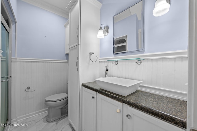 32 Windy Ct, Oriental, NC 28571 - bathroom with a wainscoted wall, vanity, marble finish floors, crown molding, and wooden walls