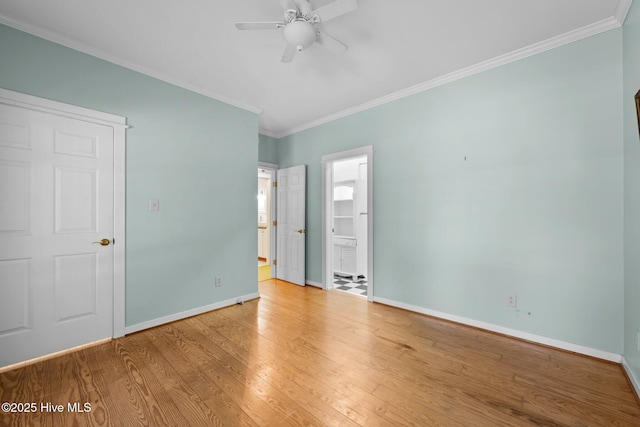 32 Windy Ct, Oriental, NC 28571 - unfurnished bedroom with ornamental molding, light wood finished floors, ensuite bath, and a ceiling fan