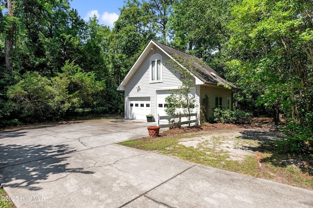 32 Windy Ct, Oriental, NC 28571 - view of property exterior featuring concrete driveway and an outbuilding
