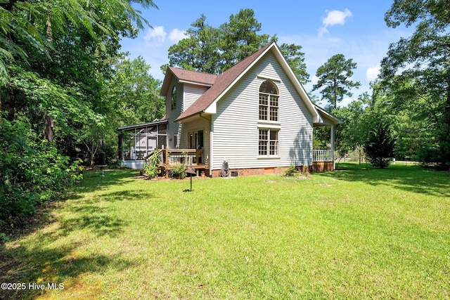 32 Windy Ct, Oriental, NC 28571 - rear view of property featuring a lawn, a sunroom, crawl space, a wooden deck, and roof with shingles