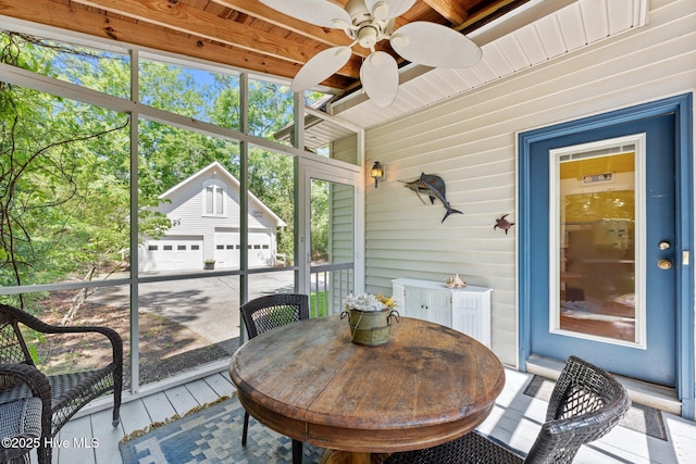 32 Windy Ct, Oriental, NC 28571 - sunroom with ceiling fan and outdoor dining space