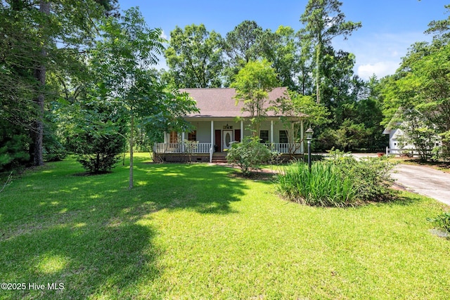 32 Windy Ct, Oriental, NC 28571 - ranch-style house with a porch, a front yard, and concrete driveway