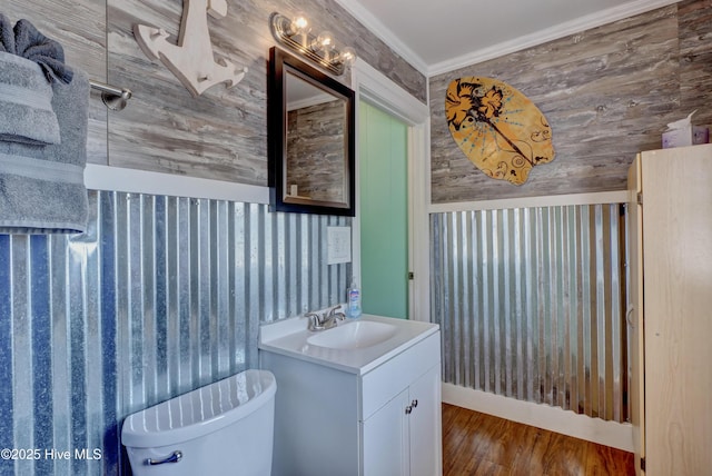 6703 13th Ave, North Topsail Beach, NC 28460 - half bathroom featuring vanity, wood finished floors, and ornamental molding