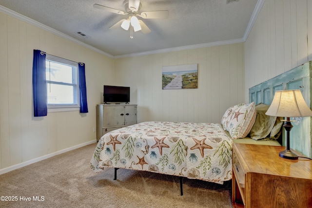 6703 13th Ave, North Topsail Beach, NC 28460 - bedroom with crown molding, carpet flooring, a textured ceiling, a ceiling fan, and wooden walls