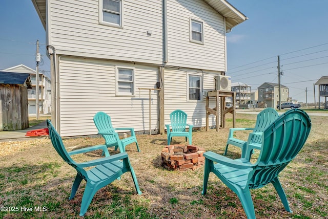 6703 13th Ave, North Topsail Beach, NC 28460 - rear view of property featuring an outdoor fire pit
