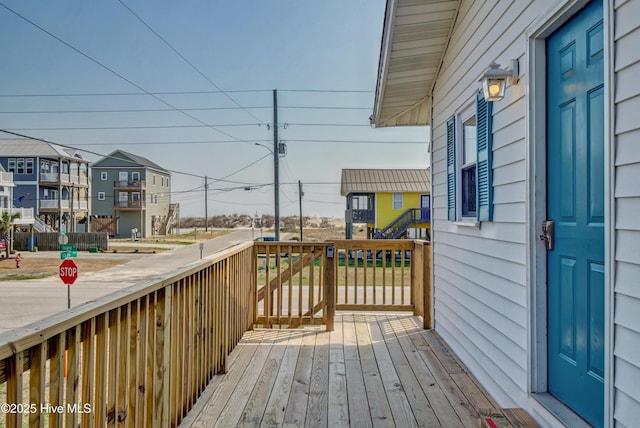6703 13th Ave, North Topsail Beach, NC 28460 - wooden terrace featuring a residential view