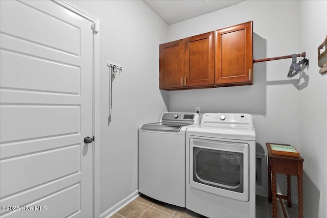 1673 White Starfish Ct, Calabash, NC 28467 - washroom featuring cabinet space, washer and dryer, and light tile patterned flooring